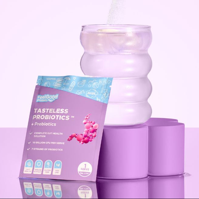 Tasteless Probiotics sample sachets by Feel Good Protein being added to a cold glass of water