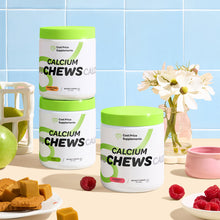 Three containers of 'Calcium Chews' on a table with fruits and flowers in the background.