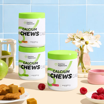 Three containers of 'Calcium Chews' on a table with fruits and flowers in the background.