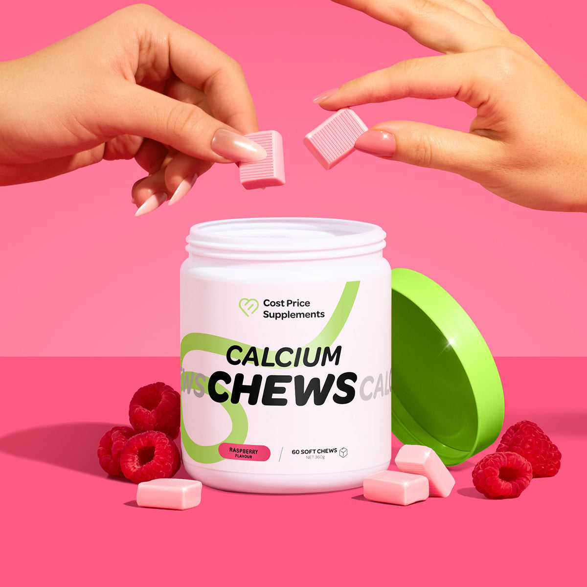 Calcium chews container with pink chews and raspberries on a pink background