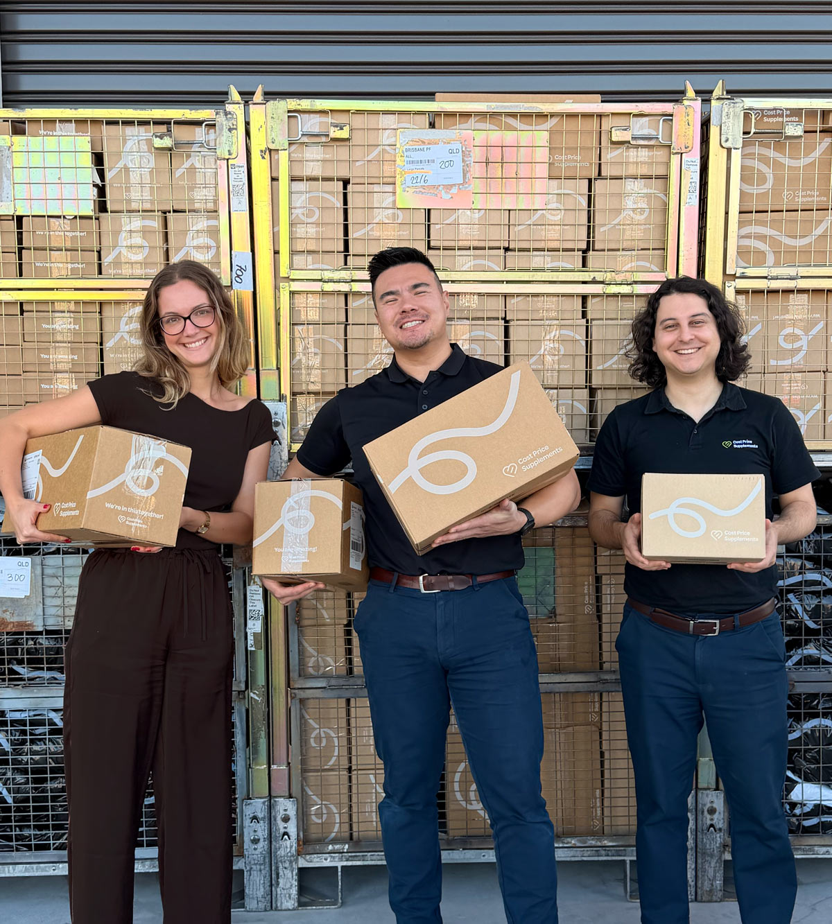 Cost Price Supplements team holding parcels
