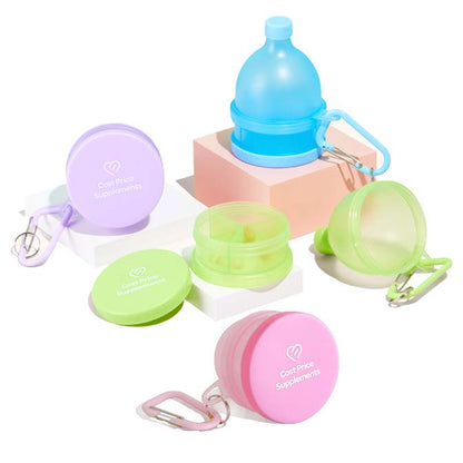 Group of powder funnels and pill containers featuring a key-chain by Cost Price Supplements.