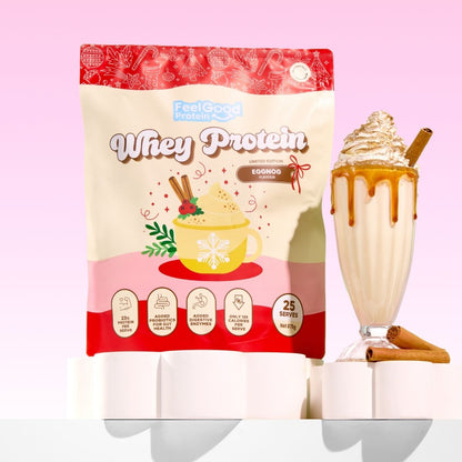 Eggnog Whey Protein by Feel Good Protein against a light red background