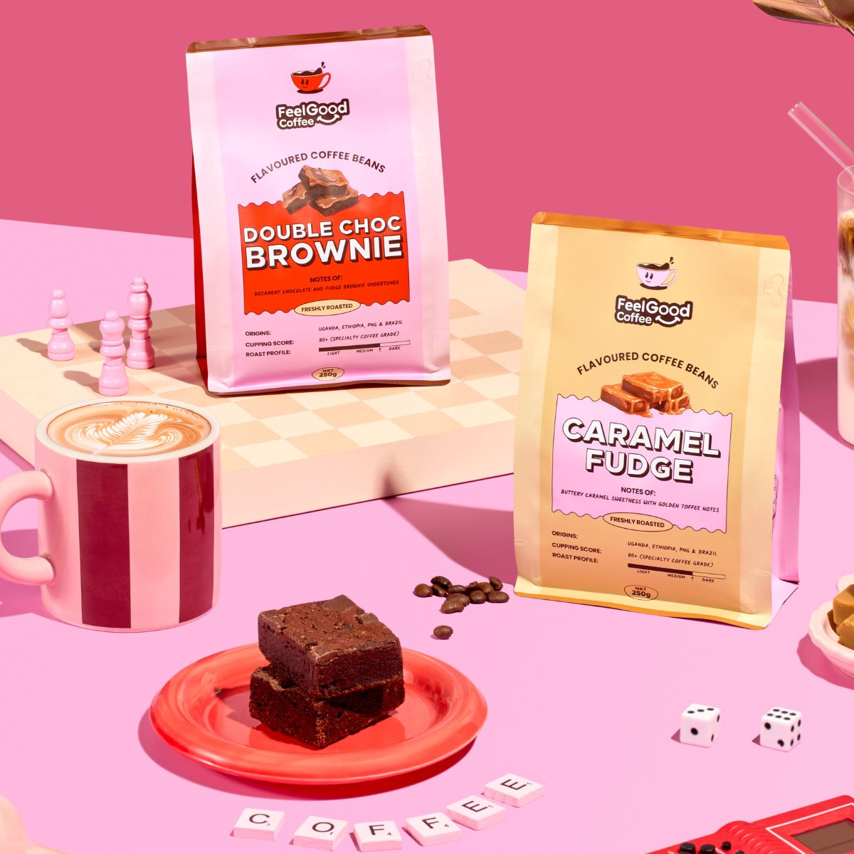 Brownie & Caramel Fudge coffee beans by Feel Good Coffee on a pink table next to brownie slices and a hot coffee
