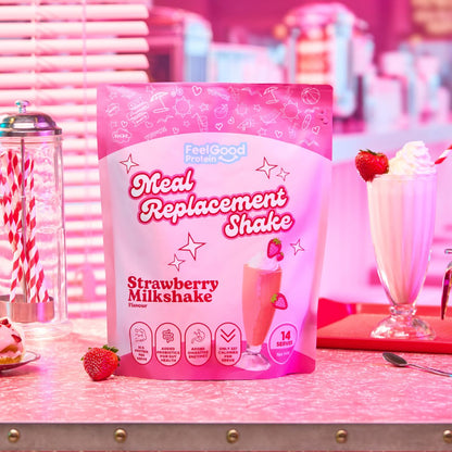 Strawberry Milkshake Meal Replacement Shake by Feel Good Protein in a retro diner next to a Strawberry shake