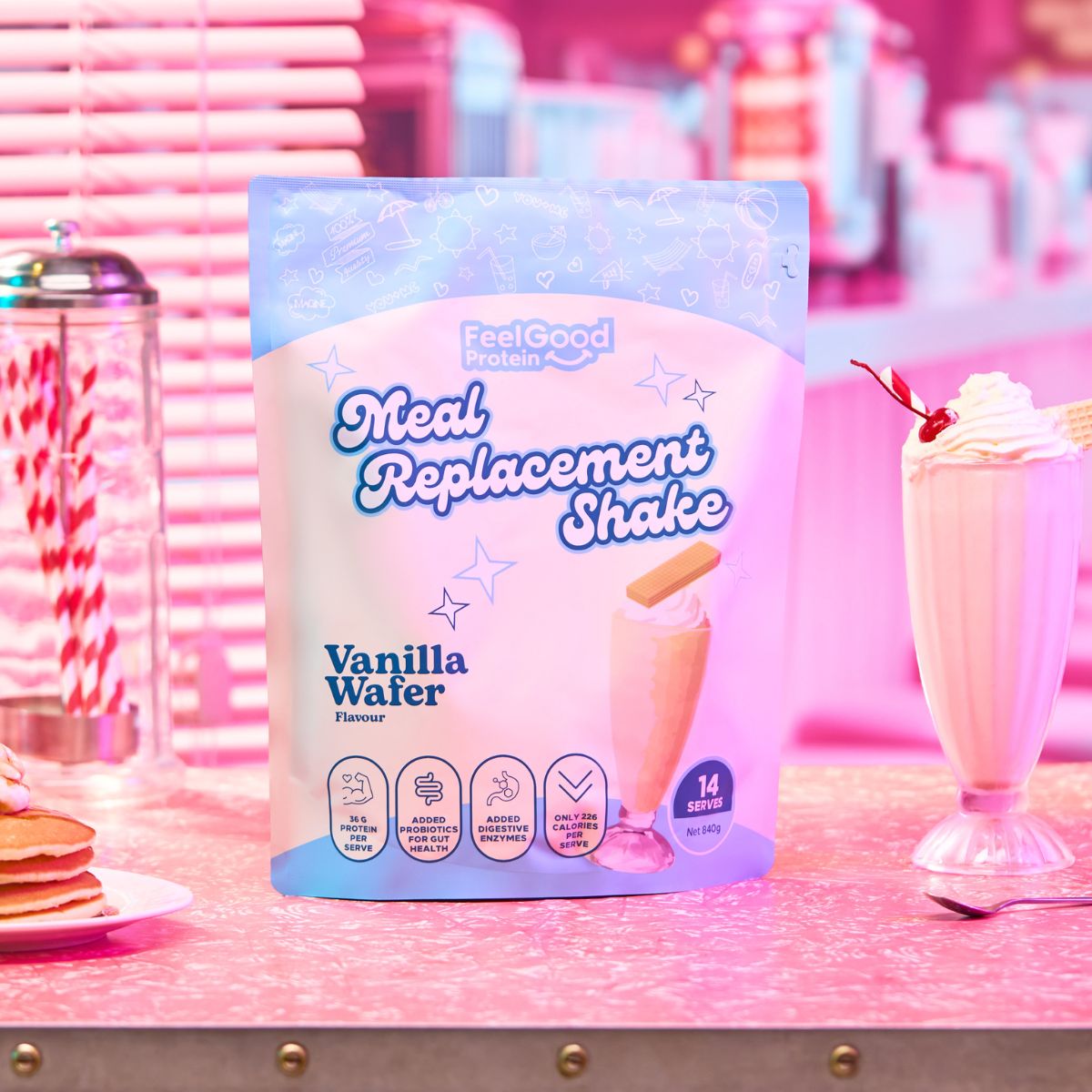 Vanilla Wafer Meal Replacement Shake by Feel Good Protein in a retro diner next to a vanilla shake