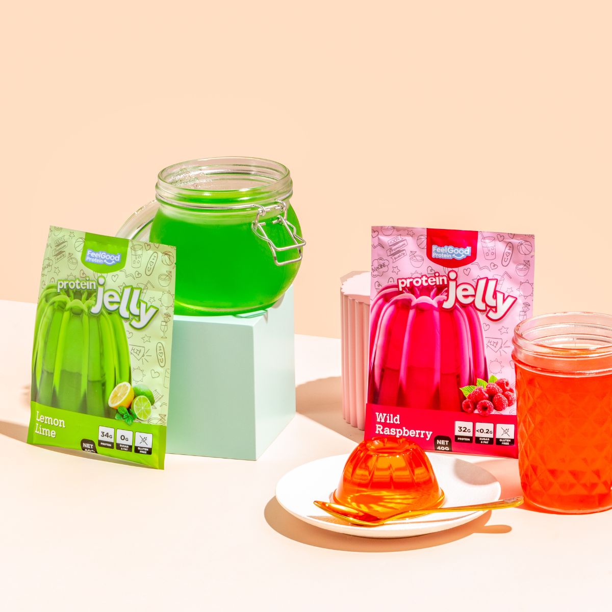 Protein Jelly by Feel Good Protein raspberry and lemon lime flavour next to jelly