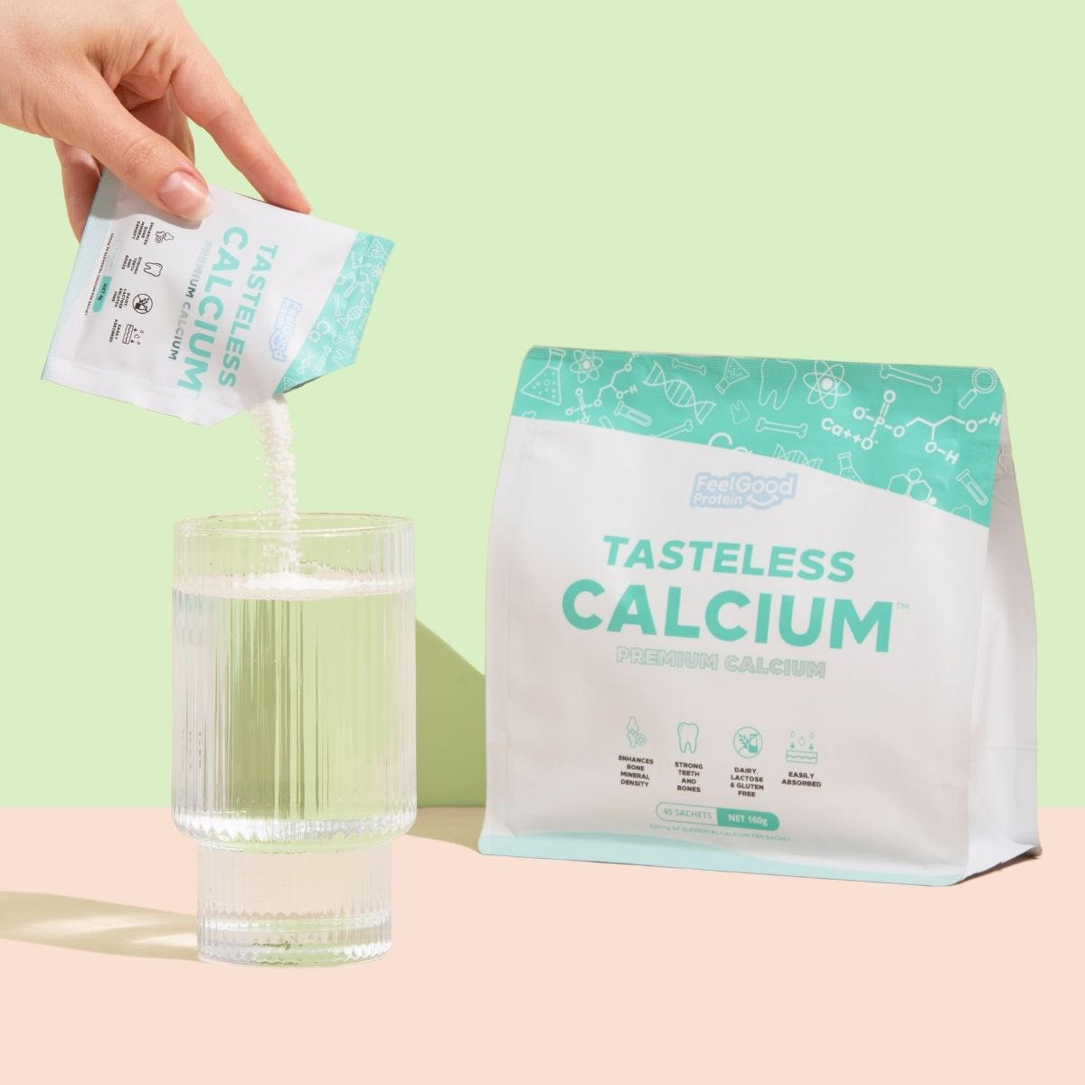 Tasteless Calcium by Feel Good Protein sachet of powder being poured into glass of water