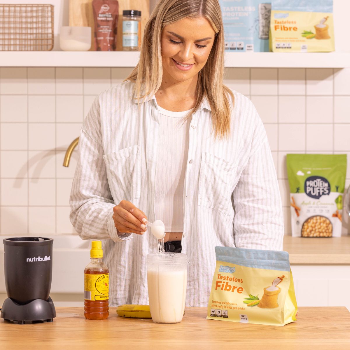 Tasteless Fibre by Feel Good Protein being mixed into a smoothie