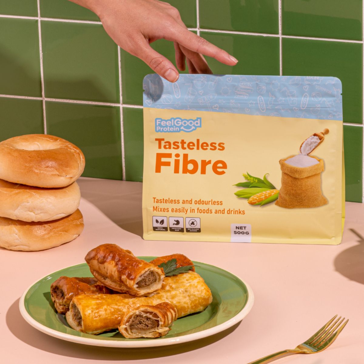 Tasteless Fibre by Feel Good Protein next to fresh sausage rolls