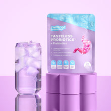 Tasteless Probiotics by Feel Good Protein on a purple platform next to ice cold water