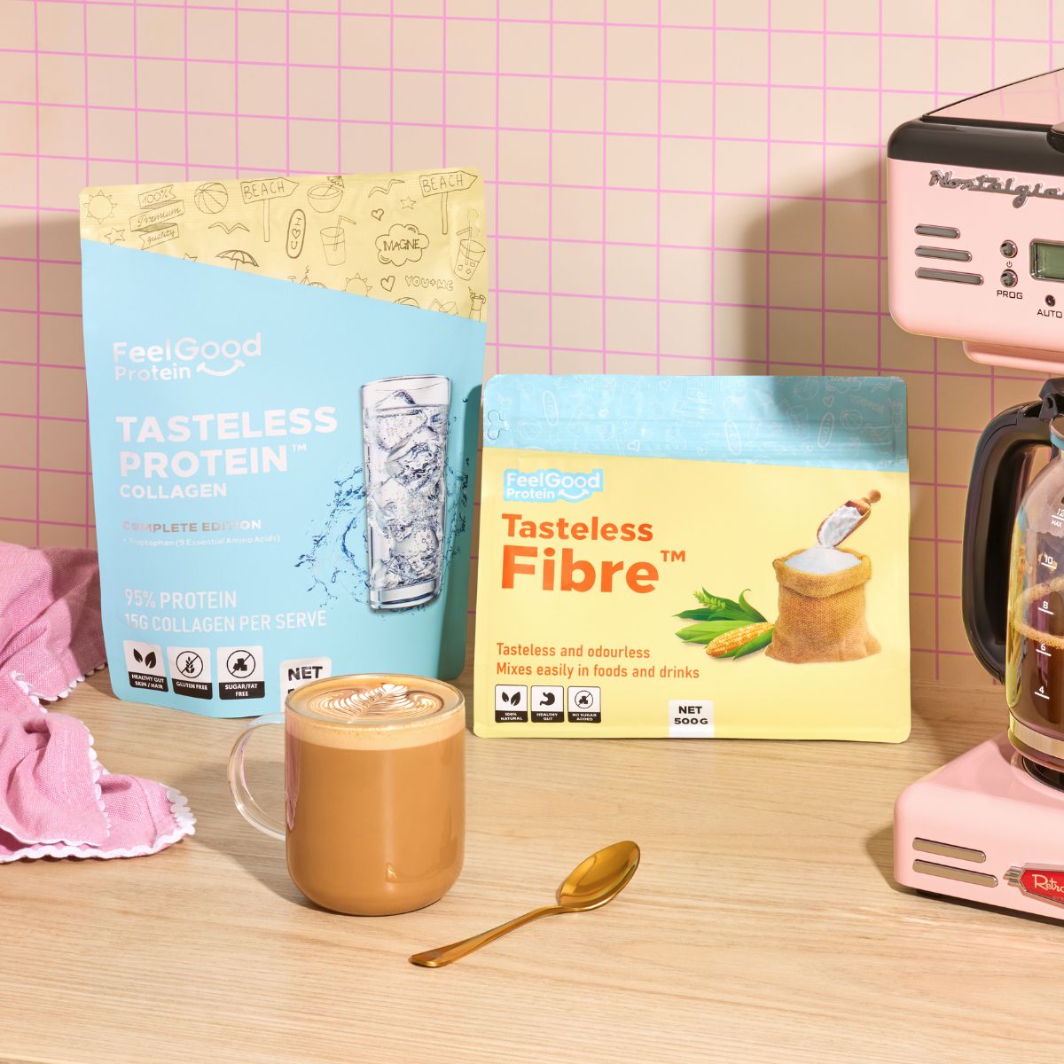 Tasteless Fibre and Tasteless Protein Bundle Pack by Feel Good Protein on a kitchen bench behind a hot coffee