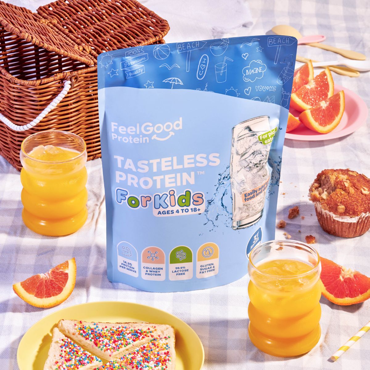 Tasteless Protein for Kids by Feel Good Protein on a picnic rug next to fairy bread