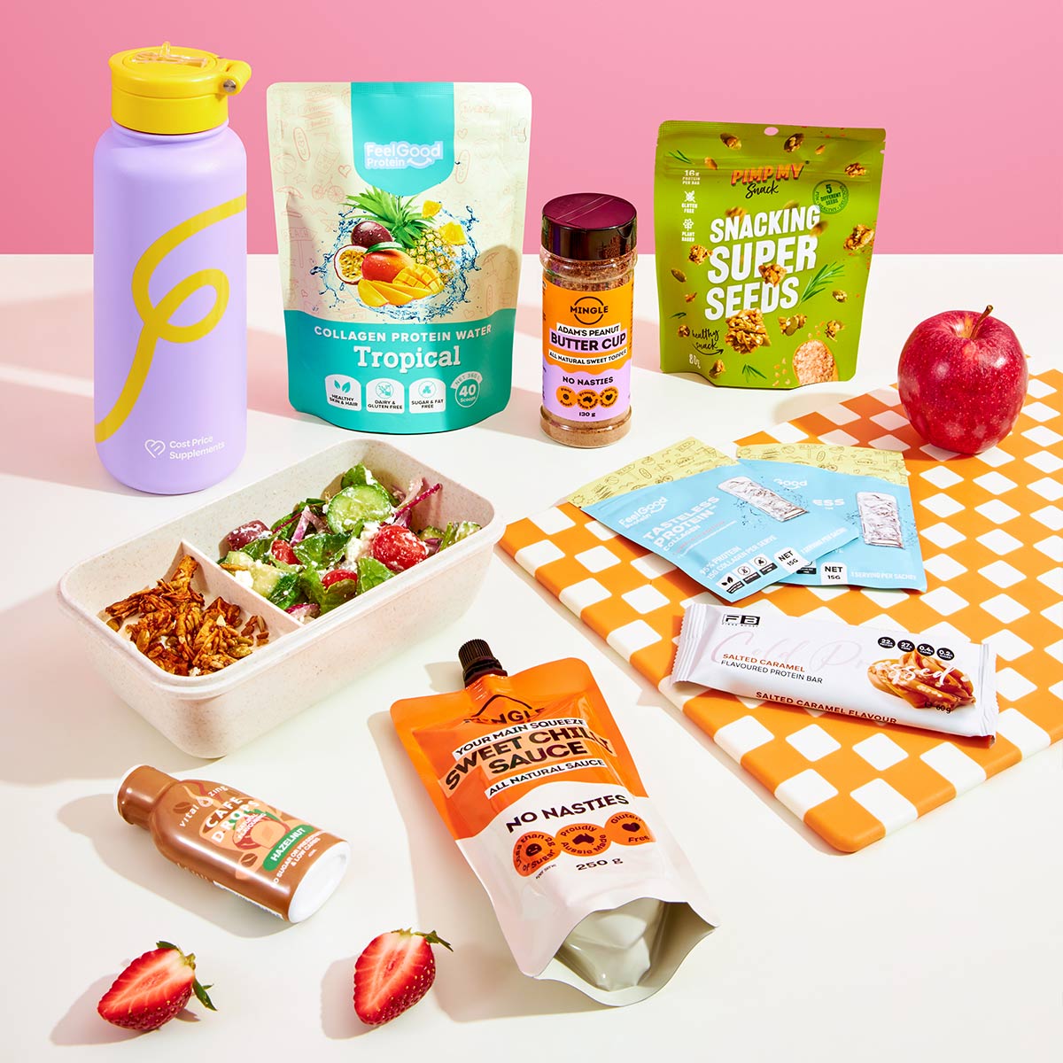 Assorted snacks and drinks on a checkered tablecloth with a pink background
