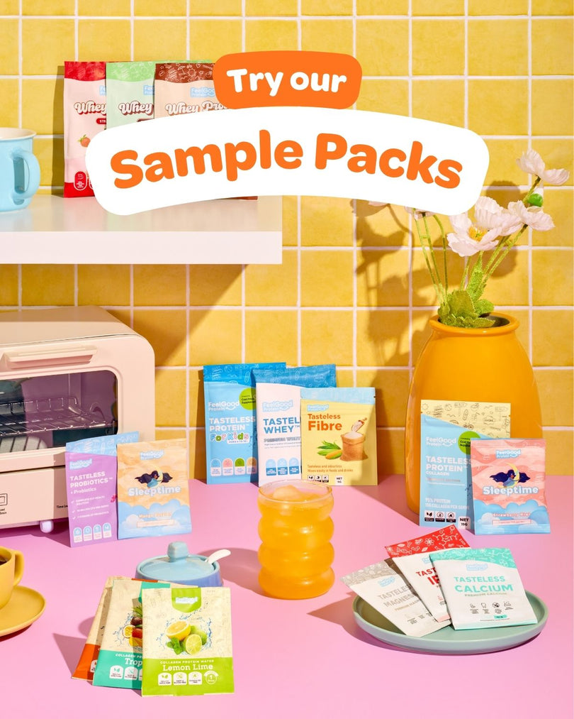 Promotional image of sample packs with a bright yellow tiled wall and pink surface.