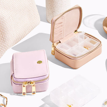 Vegan leather pill case with detachable, plastic pill container available in multiple colours.