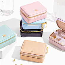 Vegan leather pill case with detachable, plastic pill container available in multiple colours.