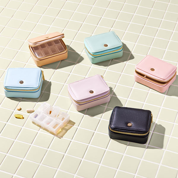 Vegan leather pill case with detachable, plastic pill container available in multiple colours.