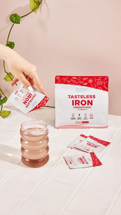 Tasteless Iron by Feel Good Protein sachets mixing easily in glass of cold water